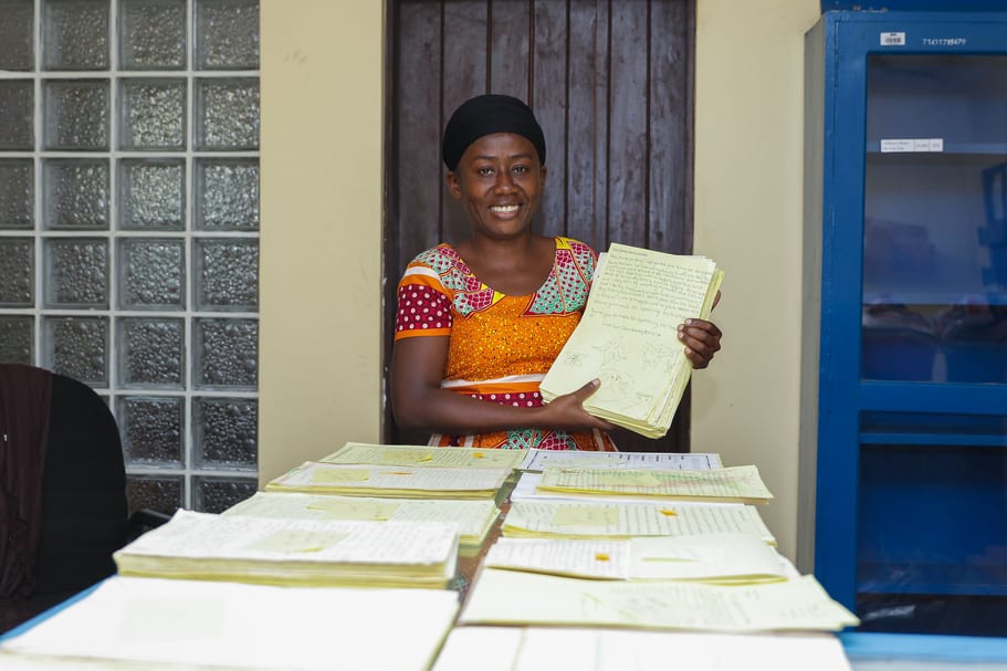 Grace holding up a sponsor letter