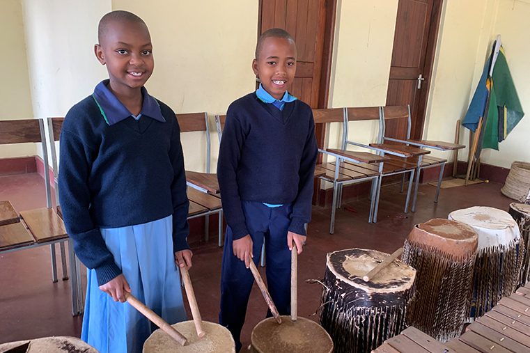 Standard 4 students, learn how to play the drums in a music class.